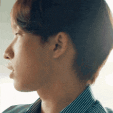 a close up of a person 's neck and ear