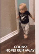 a baby is running in a hallway with the words goons nope run away