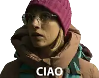 a woman wearing glasses and a purple beanie says ciao