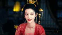 a woman wearing a red dress and a gold crown