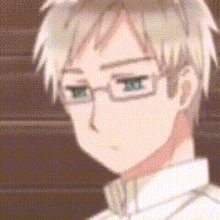 a pixelated image of a young man with glasses and a white shirt