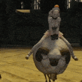 a woman is riding on the back of a large sheep .