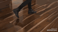 a woman is dancing in a room with the words made in animotica on the bottom