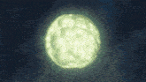a glowing green object in the dark with a blue sky in the background