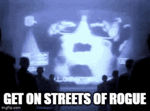 a group of people are standing in front of a screen that says " get on streets of rogue "