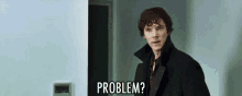 a man in a black coat is standing in front of a door and says `` problem '' .