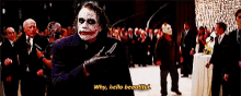 the joker is holding a knife in front of a crowd and says why hello beautiful .