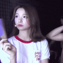 a woman wearing a white t-shirt that says babe you got this on it
