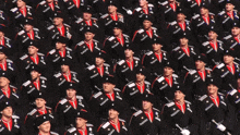 a large group of soldiers are marching in a parade