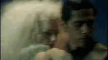 a blurry picture of a man and a woman 's faces .