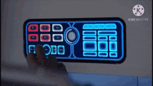 a person is pressing a button on a device that says kinemaster on the bottom right