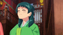 a girl with a cat ear on her head is smiling in a library .