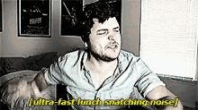 a man is sitting on a bed with his eyes closed and says ultra fast lunch snatching noise ..