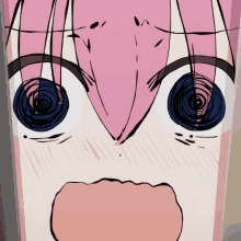 a close up of a girl 's face with a surprised expression