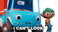 a boy standing next to a blue toy truck with the words i can 't look