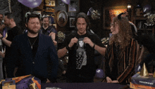 a group of people are gathered around a table with a box that says bagged heart on it