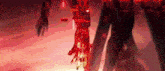 a close up of a person 's arm with red lights coming out of it .
