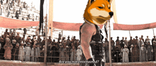 a man stands in front of a crowd with a dog on his head asking if he is not entertained