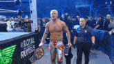 a man in a wrestling ring with a belt that says royal rumble on it