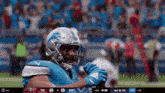 a football player wearing a helmet that says detroit lions on it