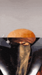 a close up of a hamburger with a tiktok logo on the bottom