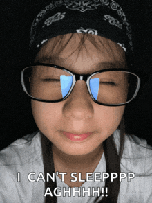 a girl wearing glasses has her eyes closed and says i can 't sleepppp aghhhh