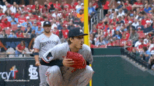 a baseball player in a minnesota jersey is kneeling down