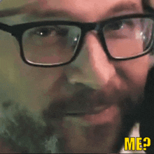 a close up of a man 's face with glasses and the word me visible