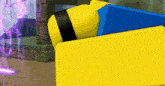 a yellow and blue block in a video game with a purple light behind it