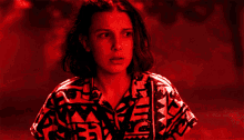 a close up of a woman 's face with a red background and a shirt that says adidas on it