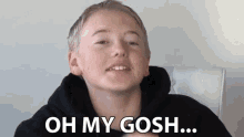 a young boy says oh my gosh in front of a white background