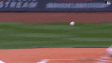 a blurred image of a baseball game with a sign that says sports cream in the background