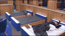 a man laying on a bed in a bedroom