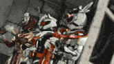 a group of robots are standing next to each other in a room
