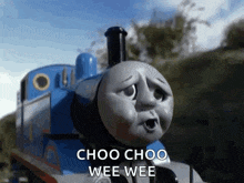 thomas the tank engine is making a sad face and saying choo choo wee wee .