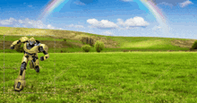 a robot is standing in a field with a rainbow in the background