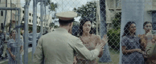 Behind Fence Couple GIF - Behind Fence Couple Love GIFs