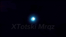 a close up of a person 's face with the word xtots on the bottom right