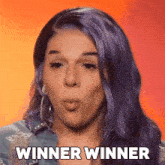 a woman with purple hair is blowing a kiss and the words winner winner are next to her
