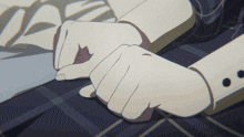 a close up of a person 's hands with black dots on the sleeves