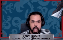 a man with a beard is wearing headphones and making a funny face