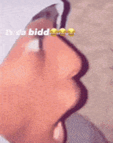 a close up of a person 's face with the words " ts da bidd " above it