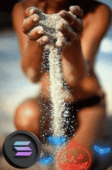 a woman is pouring sand into her hands with a coin that says solana