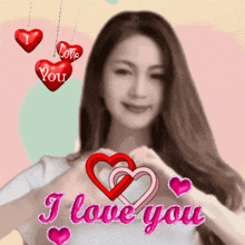 a woman is making a heart shape with her hands and the words i love you behind her