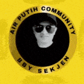 a man wearing sunglasses and a hat is in a circle with the words `` air putih community '' written around him .