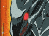 a close up of a cartoon character 's face with red eyes and sharp teeth .