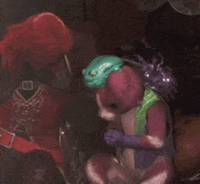 a frog sits on a cat 's head in a dark room