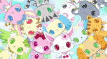 a bunch of stuffed animals are gathered together including a cat and a rabbit