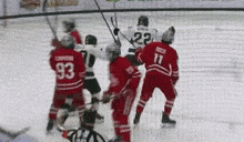 a hockey player wearing a jersey with the number 11 on it