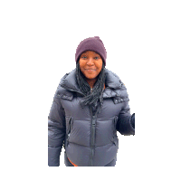 a woman wearing a purple beanie and a grey jacket